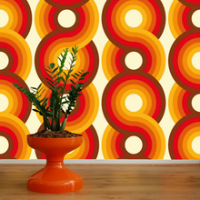 Load image into Gallery viewer, Circles Yootha Supergraphic wallpaper by 70s House manchester Estelle Bilson Bidding room, retro orange, yellow, brown and made in UK luxury wallpaper made in lancashire cermanic tiger leopard by Dogwood Lifestyle monstera cheese plant 70s vintage retro spaceage bohemian boho hippie 60s
