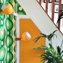 Load image into Gallery viewer, Circles Yootha wallpaper by 70s House Manchester Estelle Bilson Bidding room, shades of green on a buttermilk base made in UK luxury wallpaper made in Lancashire ceramic tiger flamingo by Dogwood Lifestyle 70s vintage retro spaceage bohemian boho hippie 60s funky mid century