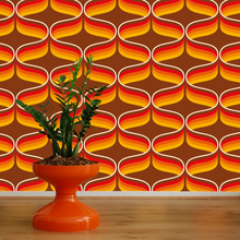 Load image into Gallery viewer, 70s retro wallpaper with orange, yellow and red swirls on a chocolate background
