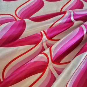 pink retro 70s style print with supergraphic swirls 70s mid century funky retro velvet fabric