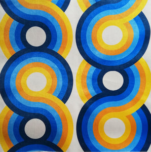 yellow, light blue, navy and orange swirling 70s retro wallpaper called Yootha Ocean 70s retro funky  mid century style velvet fabric 